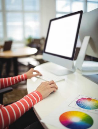Graphic designer working at her desk in the office